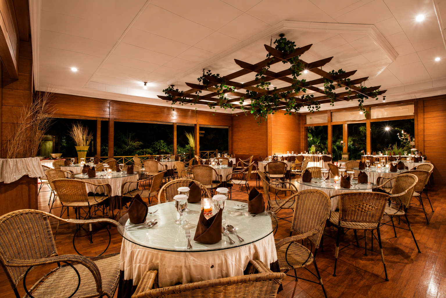 Elegant warm luxury restaurant interior at Citra Garden Hotel Puncak with wooden decor and romantic dining atmosphere