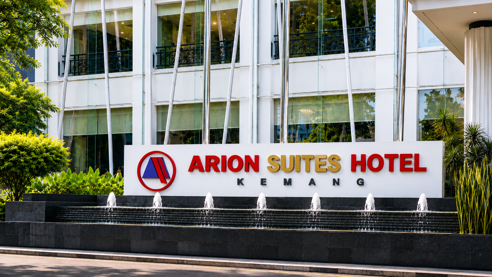Tampilan depan Arion Suites Hotel Kemang dengan signage hotel, air mancur, dan bangunan hotel modern di Jakarta Selatan
